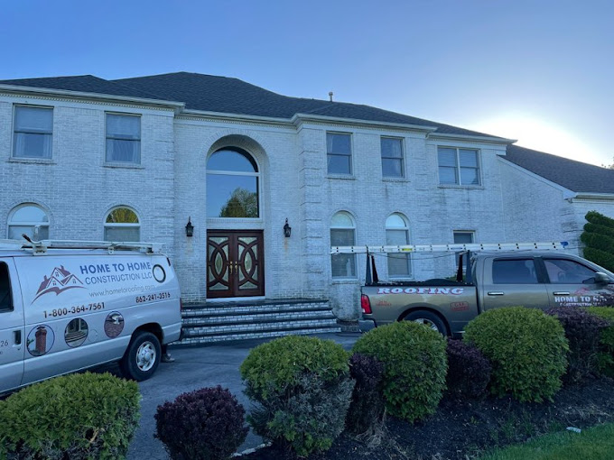 Home to Home Construction Van Infront of a beautifully finished construction sight in Fair Lawn NJ