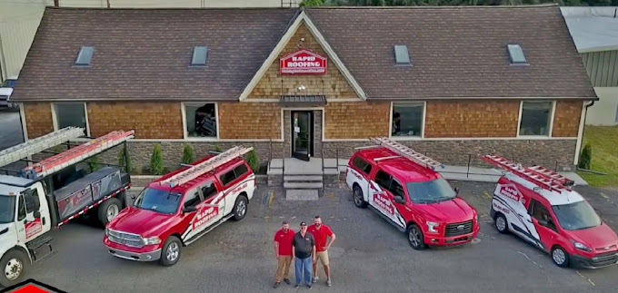 Rapid Roofing Vans in front of headquarters in Michigan